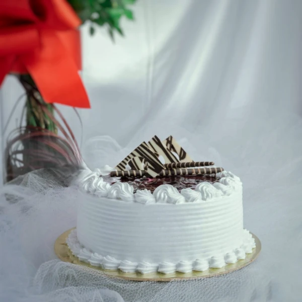 Roses In A Vase And Cake